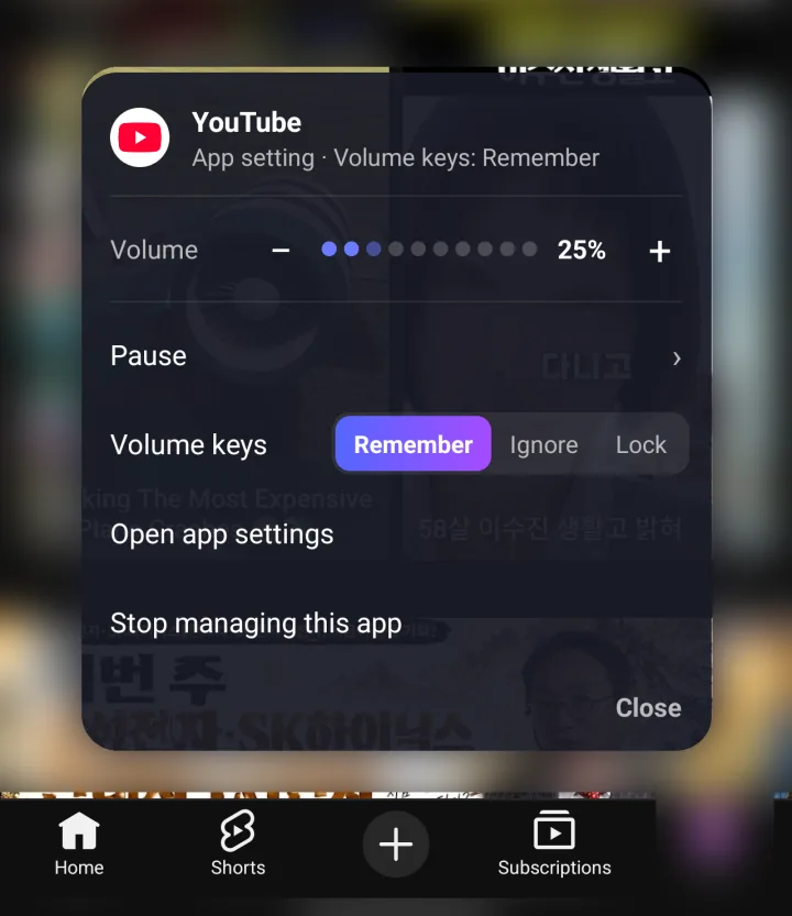 AppVolume's on-screen menu over a blurred video app: volume at 25%, Pause, volume key modes and Stop managing this app.